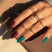 matte teal and burgundy nail design