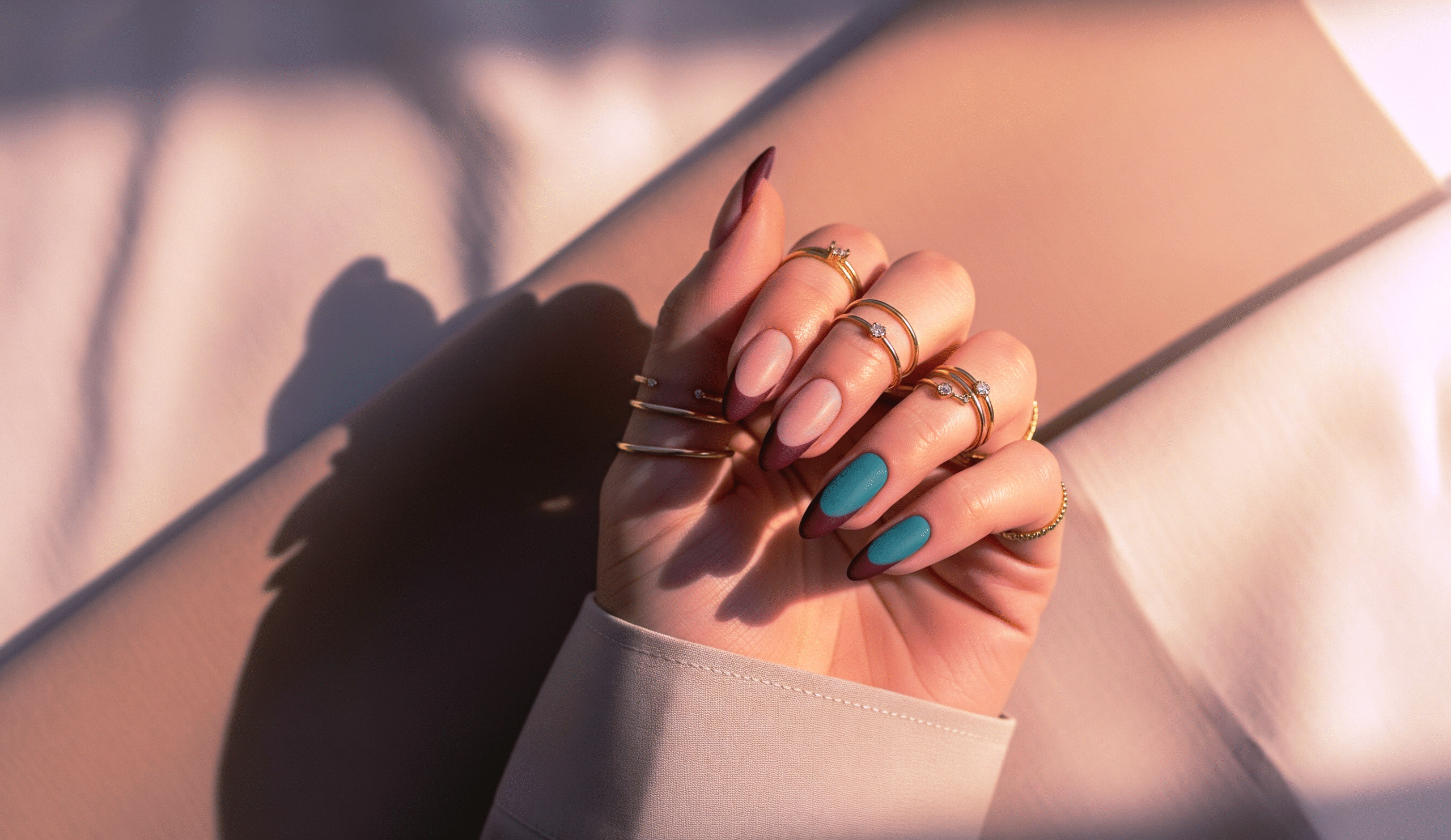 matte teal and burgundy nail design