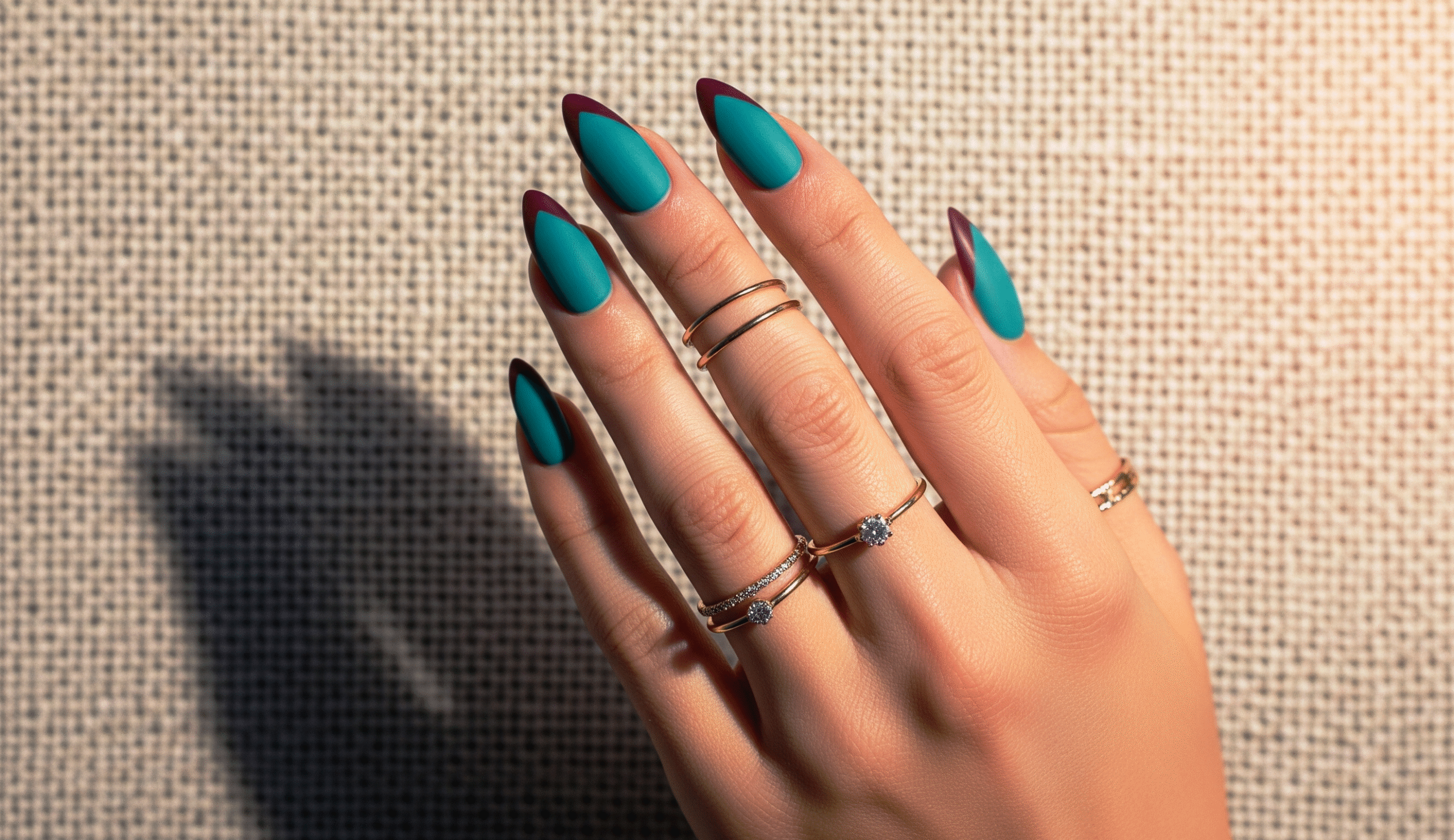 matte teal and burgundy nail design